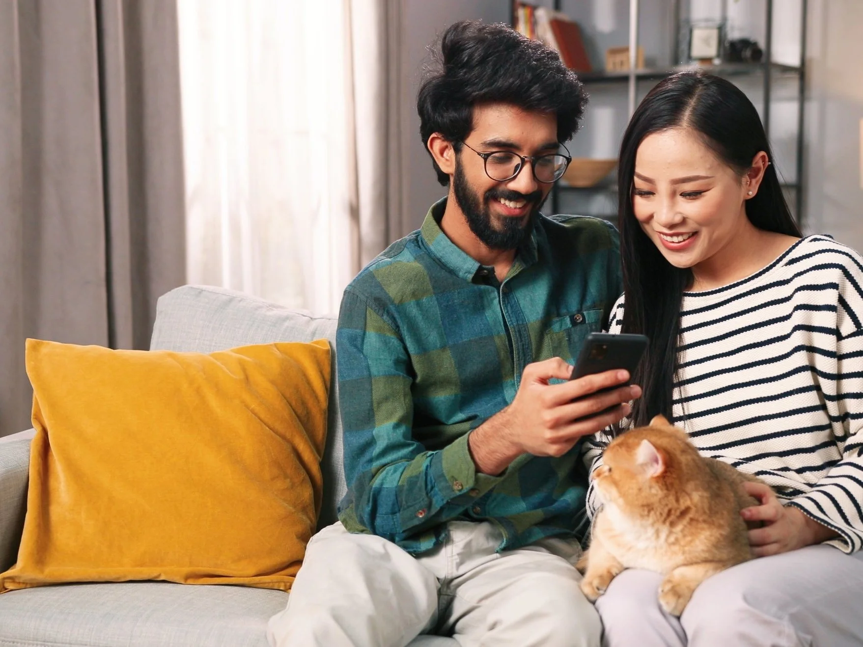 Pet Owner Using Vetibility App on Laptop with Dog